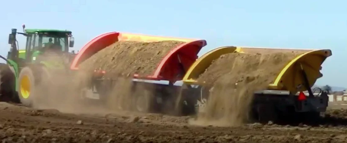 SmithCo sidde dump trailers dumping dirt